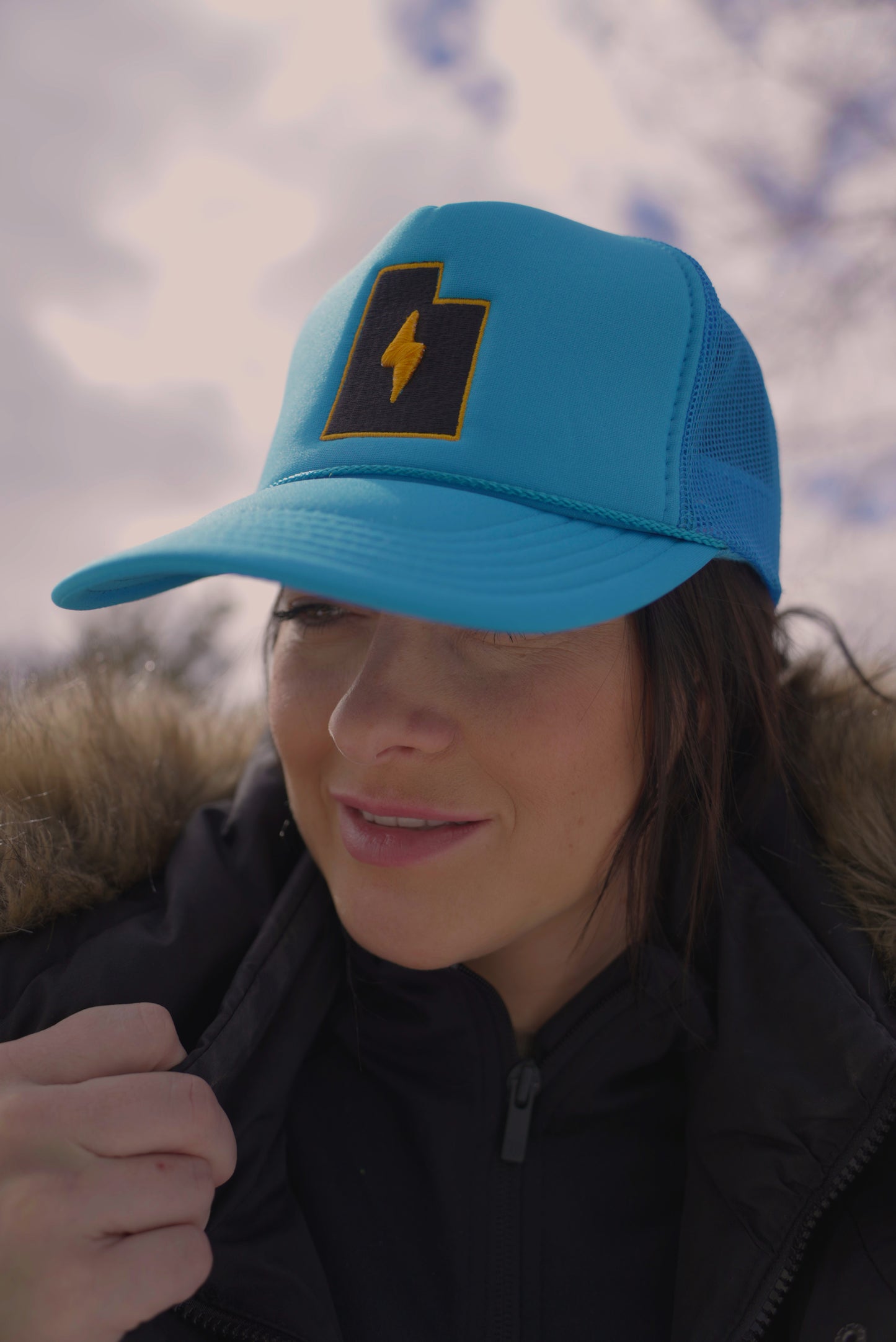 TMG Always Earned Trucker Hat in LMTD Blue