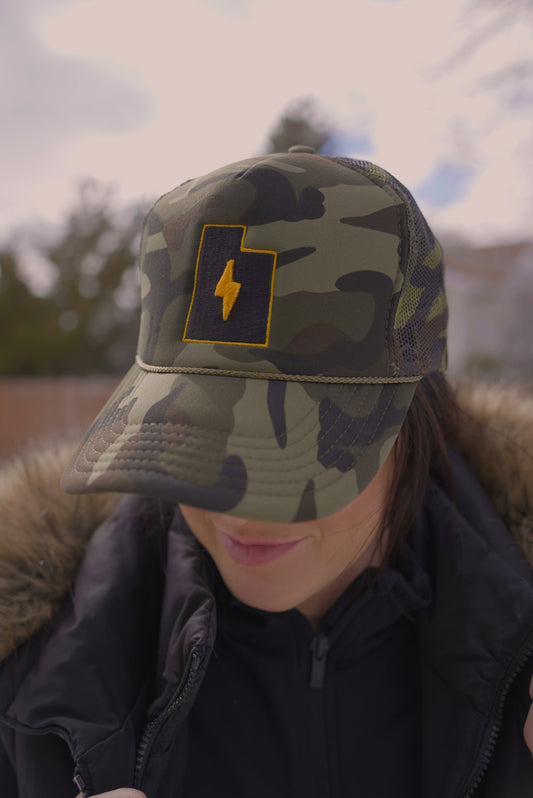 TMG Always Earned Trucker Hat in Camo